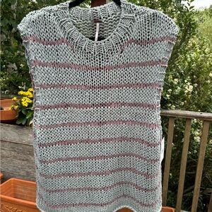Free People sleeveless sweater size medium. Roomy fit with grayish blue/ purple.